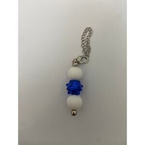 Blue and white straw charm